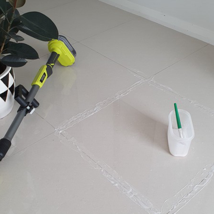 Cleaning floor grout using a RYOBI telescopic scrubber and homemade cleaner